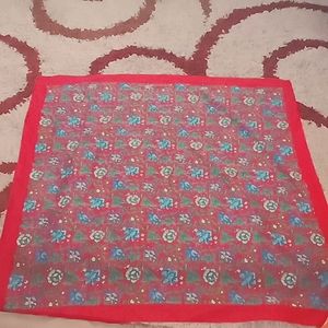 Access 31"x 31" scarlet satin scarf with blue/yellow floral pattern.